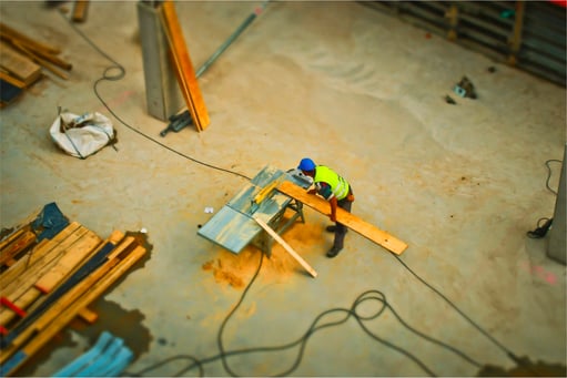 Various wood beams are shown inside a building.