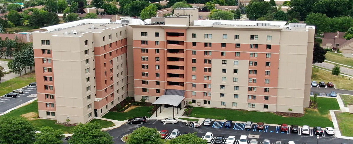 beige and brick veneer apartment building
